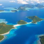 Aerial view of tropical islands in turquoise waters.