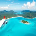 Flugzeug fliegt über Tahitis wunderschöne Inseln und Gewässer.