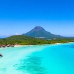 Tropical islands with overwater bungalows, turquoise water