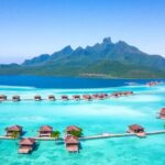 Bora Bora overwater bungalows and turquoise lagoon.